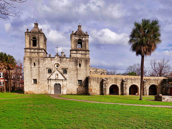 View of bell tower against cloudy sky