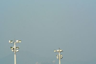 Low angle view of floodlight against clear sky