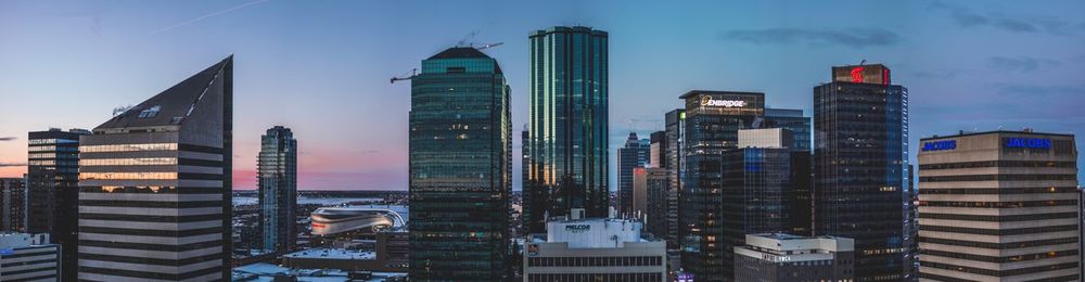 Modern buildings in city against sky