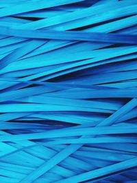 Full frame shot of cables against blue background