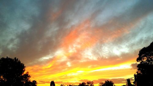 Low angle view of dramatic sky during sunset