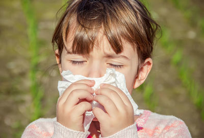 Close-up of girl drinking milk