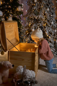 Rear view of woman with teddy bear
