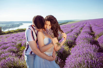 Loved people in a lavender field, a man and a woman love each other