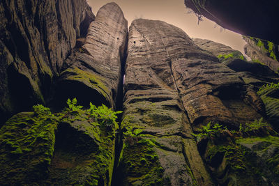 Low angle view of rock formations against sky