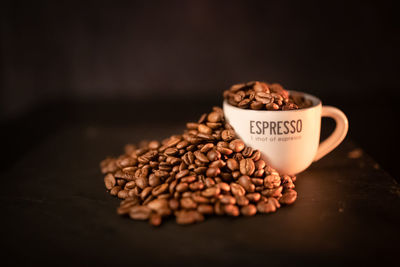 Close-up of coffee beans on table