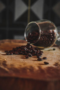 Close-up of coffee beans in glass on table