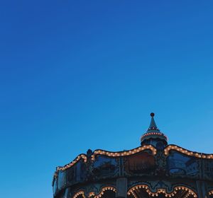 Low angle view of historical building against clear blue sky