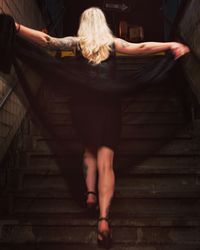Close-up of woman standing on wood