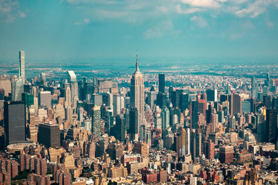 Panoramic view of modern buildings in city against sky