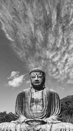 Statue of buddha against sky