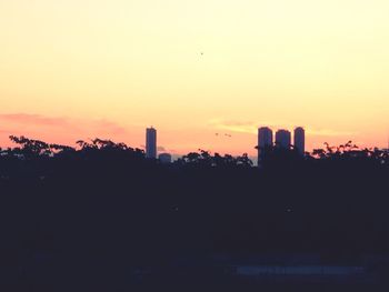 Silhouette of building at sunset