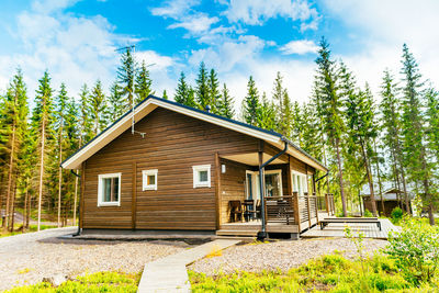 House with trees in background