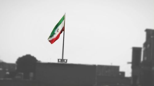 Low angle view of flag against clear sky