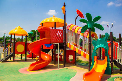 Colorful playground on blue sky 