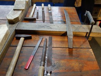 High angle view of work tools and workbench