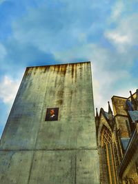 Low angle view of bell tower against sky