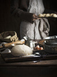 Man preparing food on table in kitchen