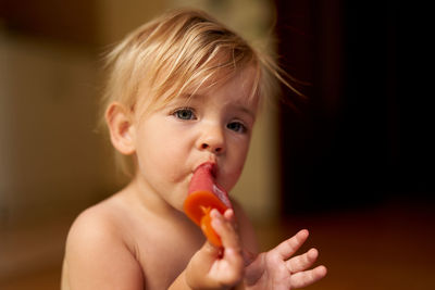 Portrait of cute boy eating ice cream