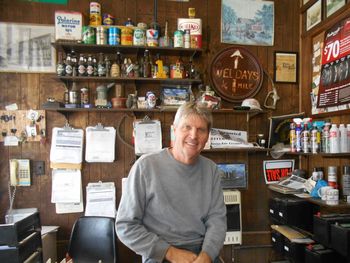 Portrait of a smiling young man standing at store