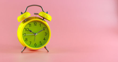 Close-up of clock on wall