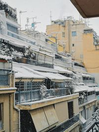 High angle view of buildings in city during winter