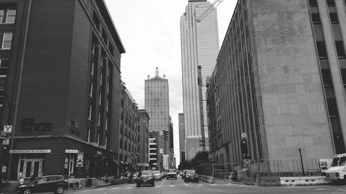 City street amidst buildings against sky