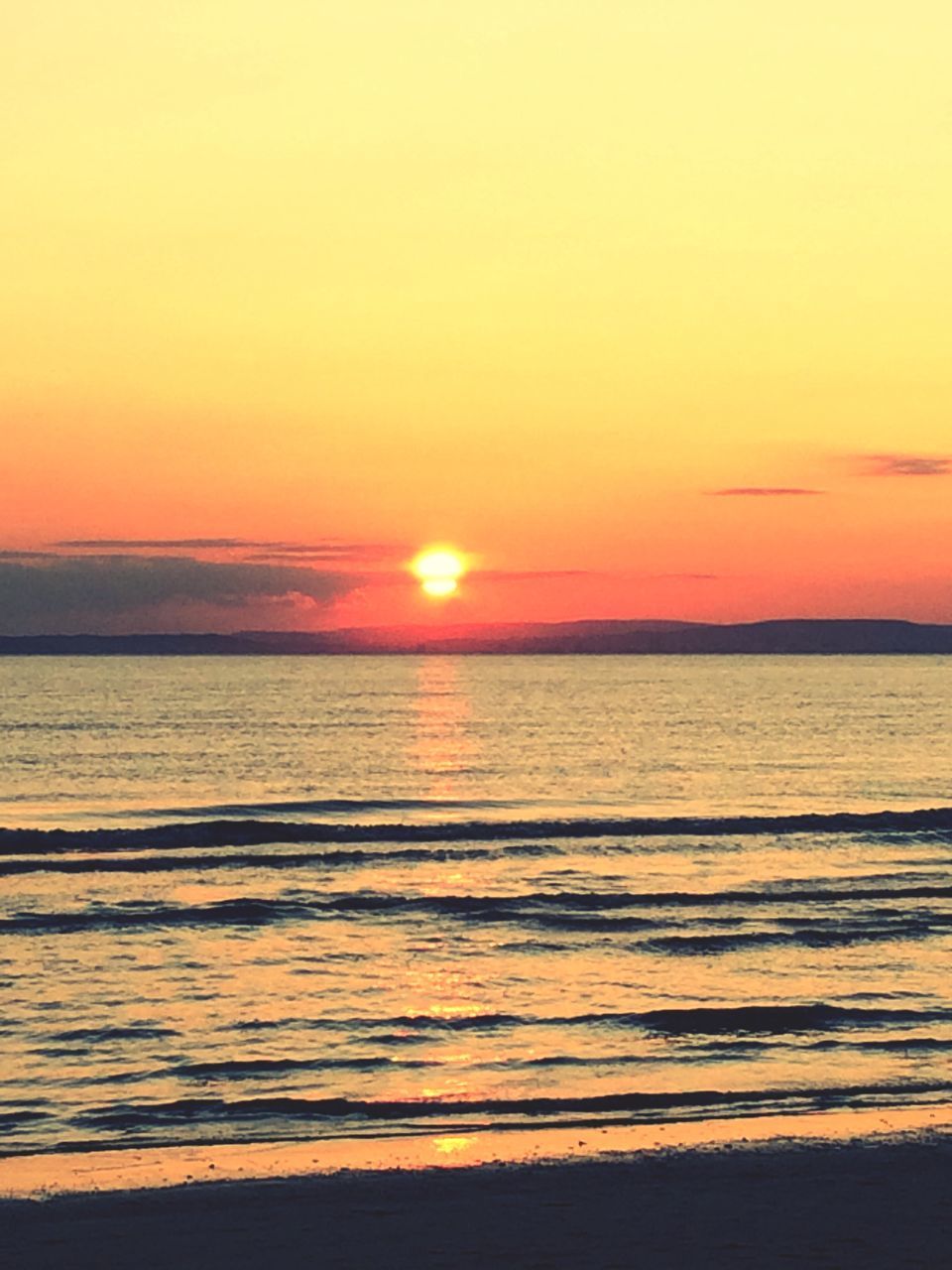 sunset, sea, water, scenics, beach, tranquil scene, beauty in nature, horizon over water, orange color, sun, tranquility, shore, idyllic, nature, sky, wave, reflection, sunlight, sand, remote