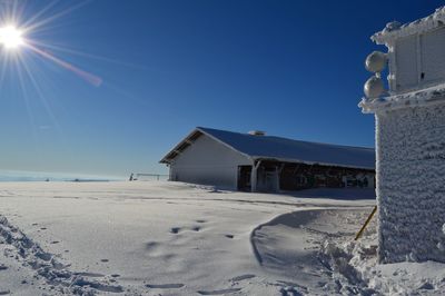 Scenic view of beach against clear sky during winter