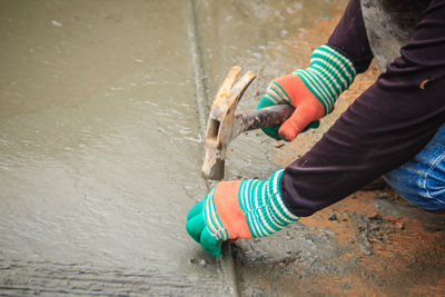 Low section of man working in water