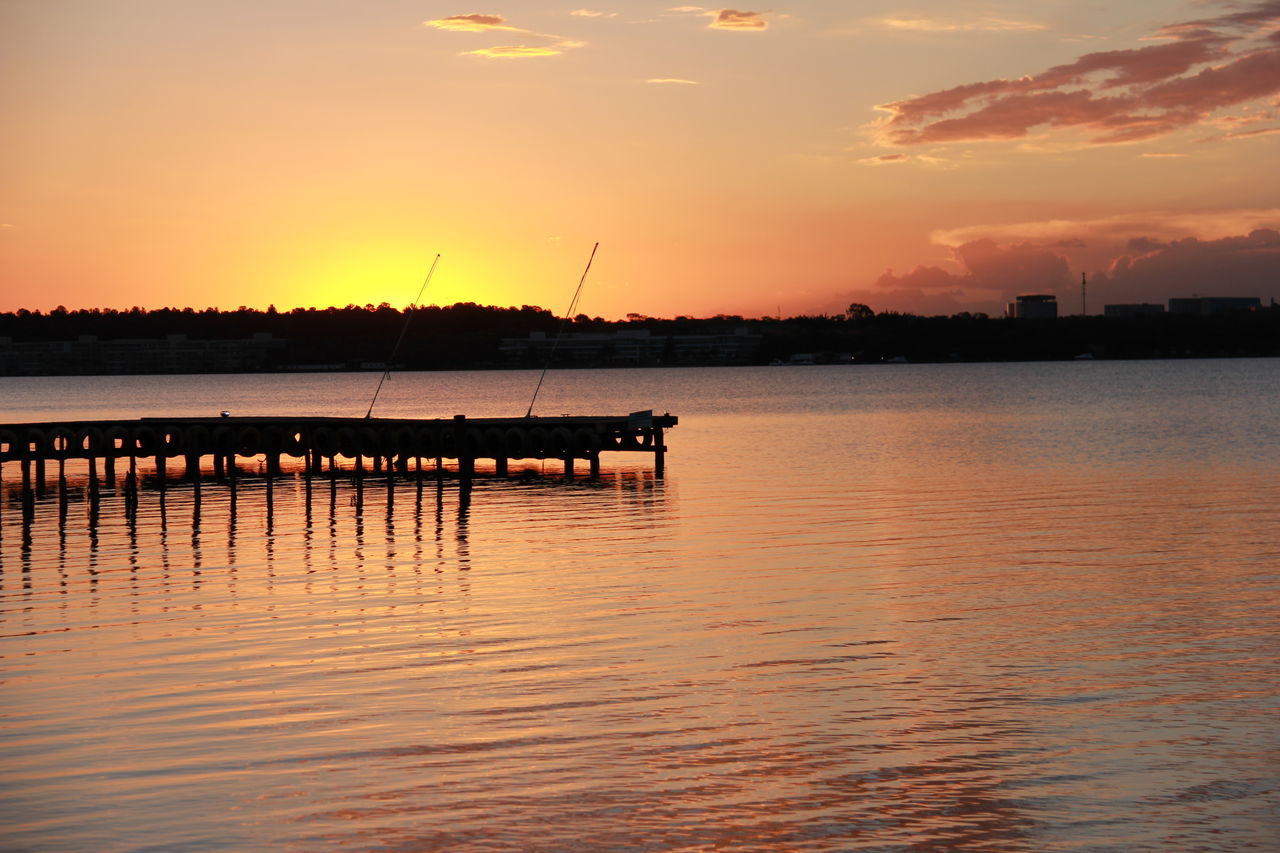 sunset, water, silhouette, tranquil scene, tranquility, reflection, scenics, orange color, waterfront, beauty in nature, sky, pier, lake, idyllic, nature, rippled, sun, sea, jetty, nautical vessel