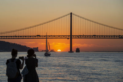 Silhouette people at sunset