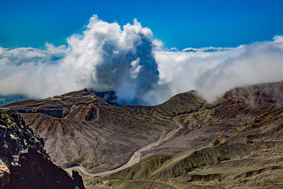 Heavy smoke bursting out from active volcano crater of aso in kyushu, japan