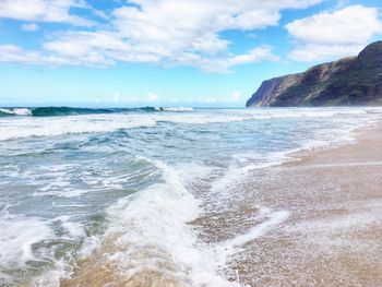 Scenic view of beach against sky