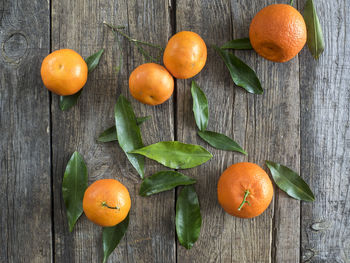 Close-up of oranges on wood