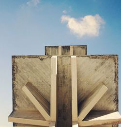 Low angle view of wooden diving platform against sky