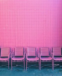 Chairs against purple wall