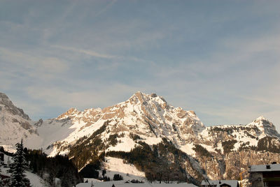 Scenic view of snowcapped mountains against sky