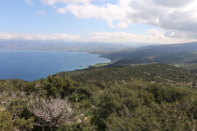 High angle view of townscape by sea against sky