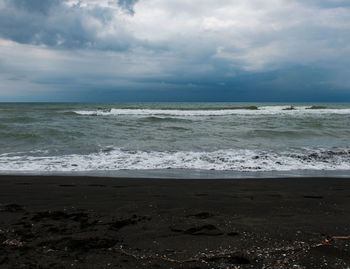 Scenic view of beach against sky