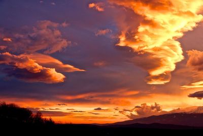 Low angle view of dramatic sky during sunset