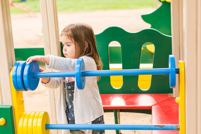 Girl playing with toy at playground