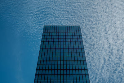 Close-up of building against blue sky