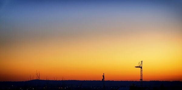 Scenic view of silhouette landscape against clear sky at sunset