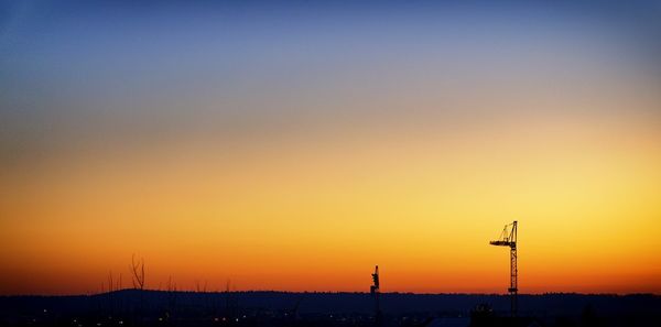 Scenic view of silhouette landscape against clear sky at sunset