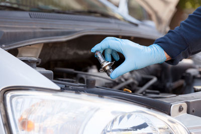 Close-up of hand holding car