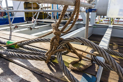 High angle view of ropes on railing
