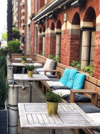 Potted plants on table by building