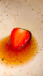 Close-up of red fruit on white background