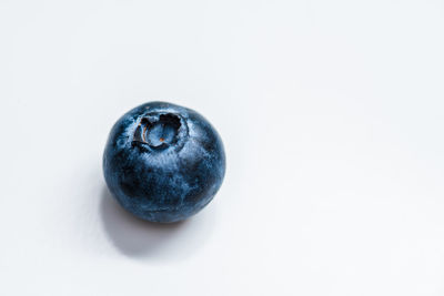 Close-up of fruit over white background